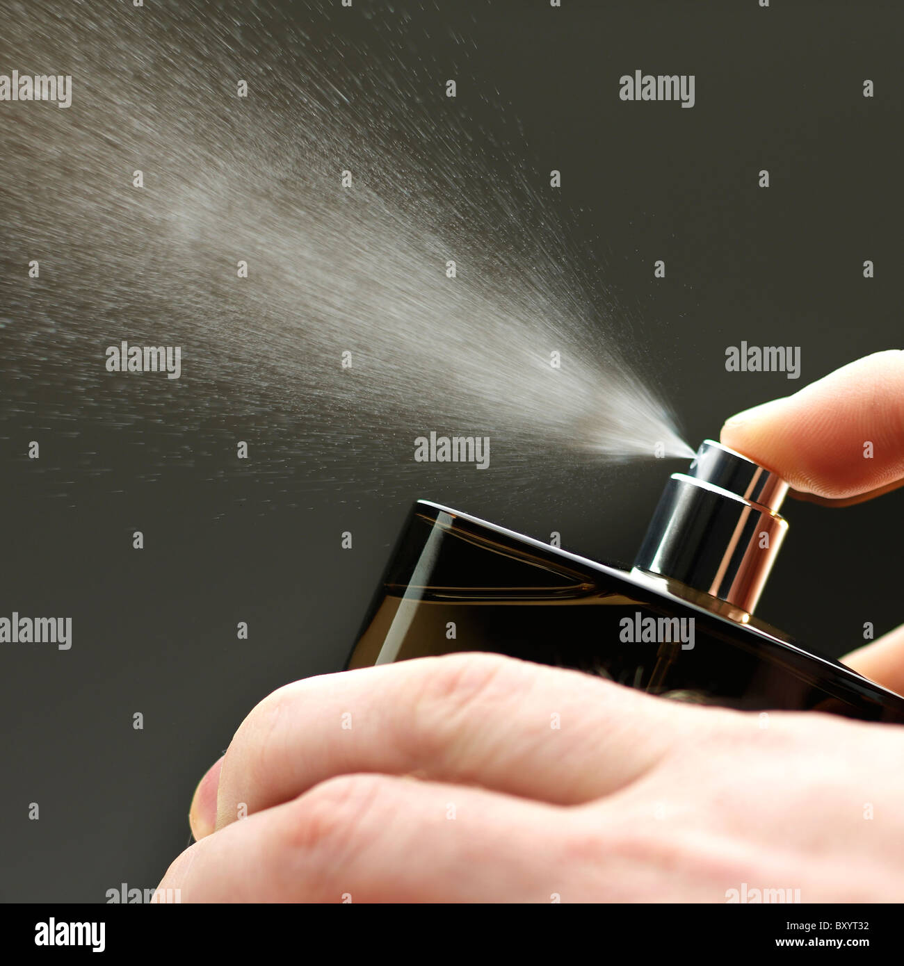 spray from aftershave / perfume bottle Stock Photo