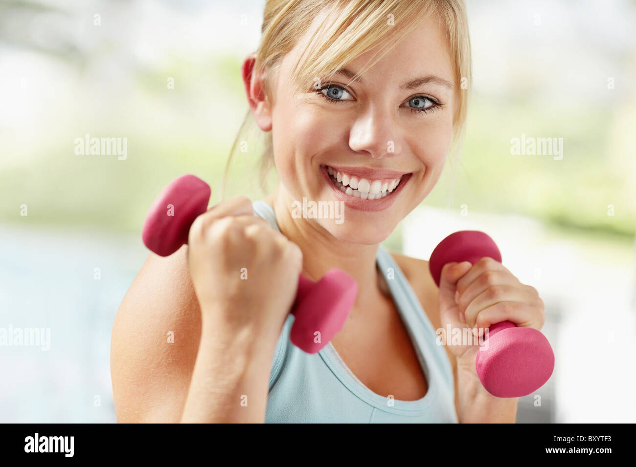 Portrait of young blonde woman exercising Stock Photo - Alamy