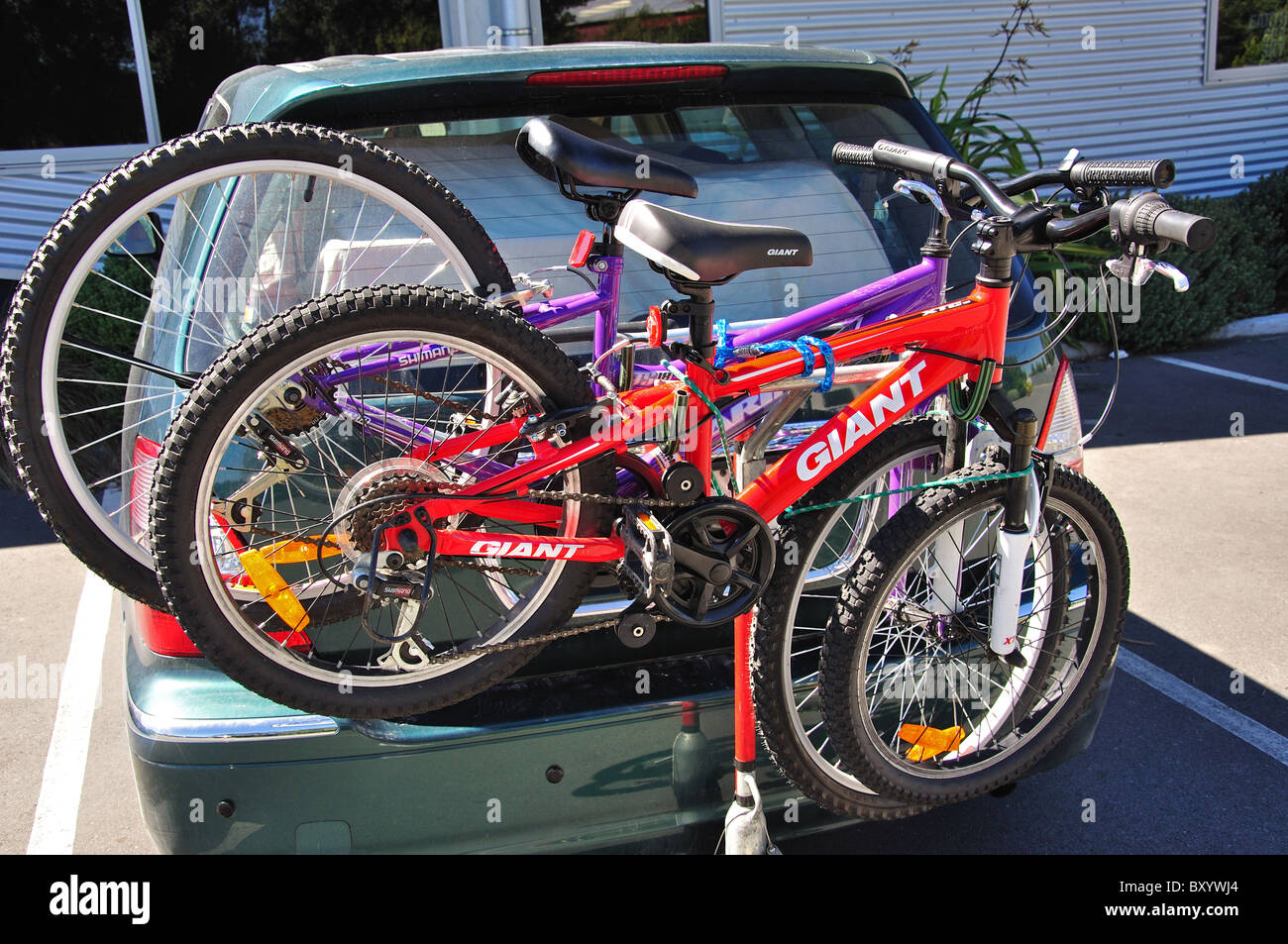 Mountain bikes on back of car, Rakaia, Canterbury, South Island, New Zealand Stock Photo