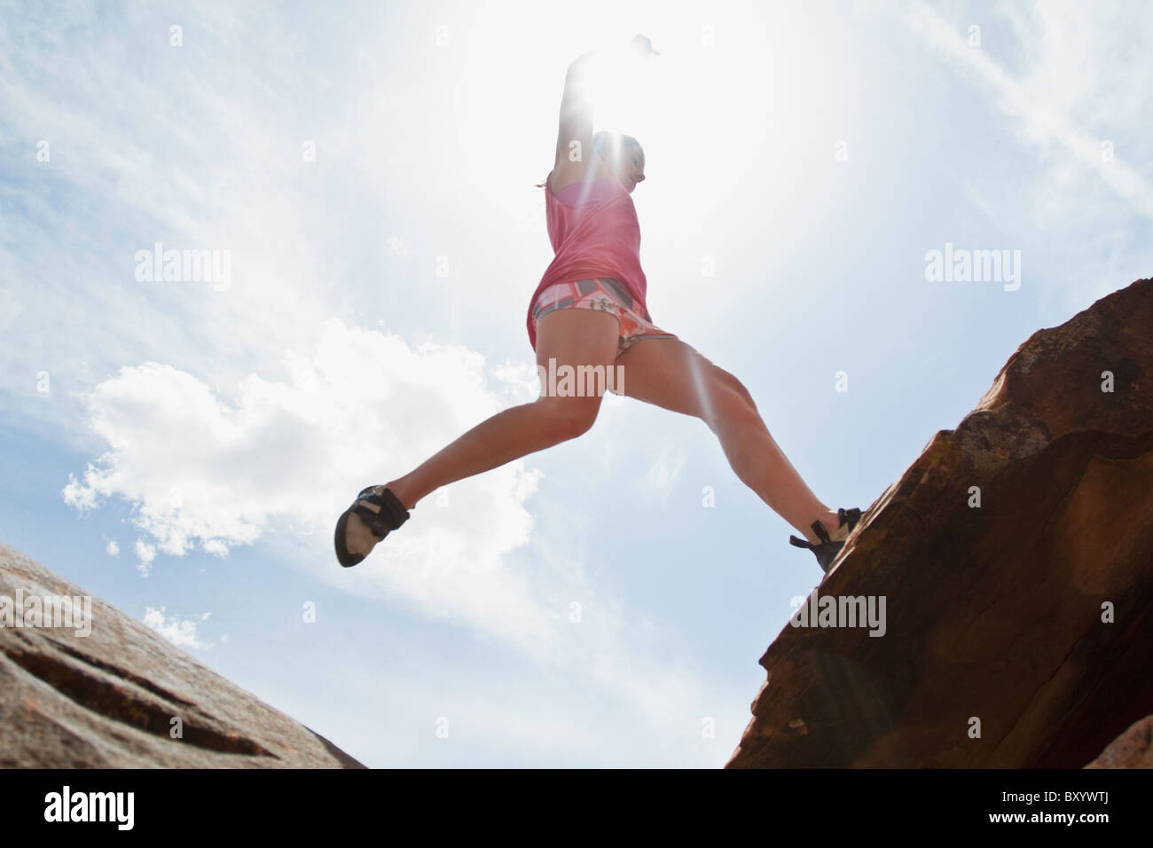 Woman rocks jump hi-res stock photography and images - Alamy
