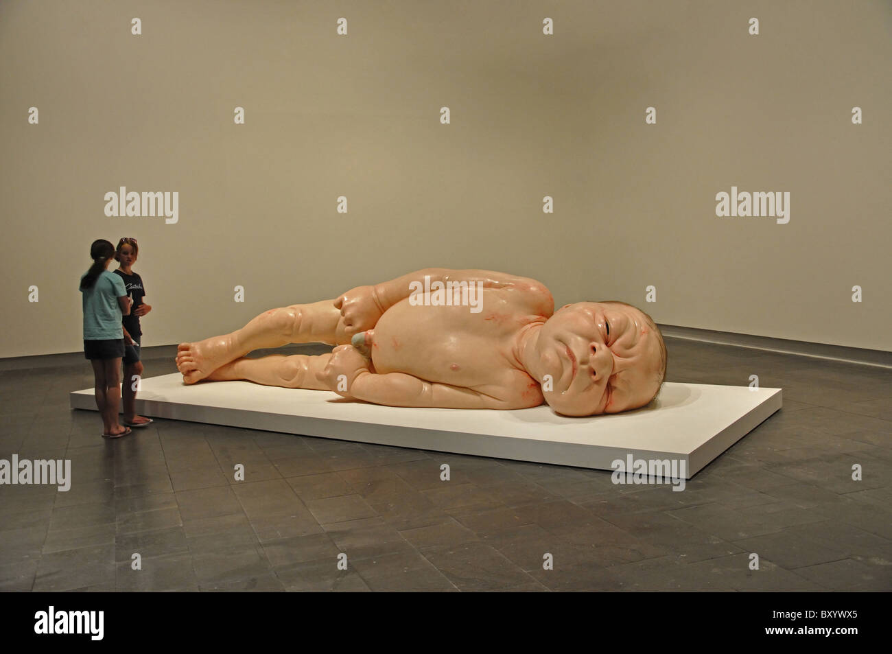 'Newborn baby' sculpture at Ron Mueck Exhibition, Christchurch Art Gallery, Christchurch, Canterbury, South Island, New Zealand Stock Photo