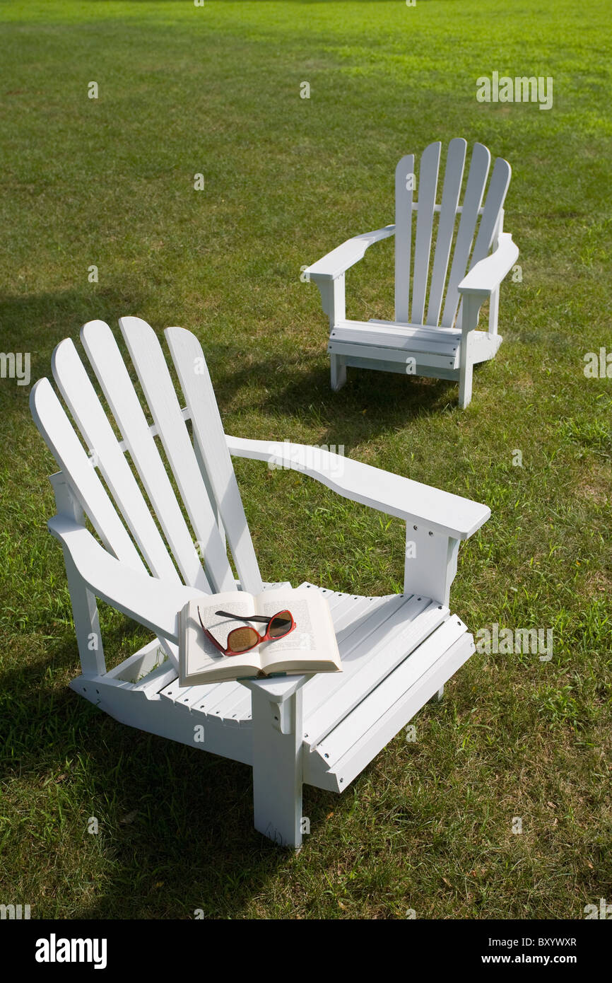 Two adirondack chairs on lawn Stock Photo Alamy