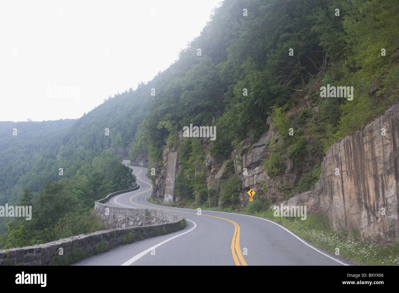 Winding road through mountains Stock Photo