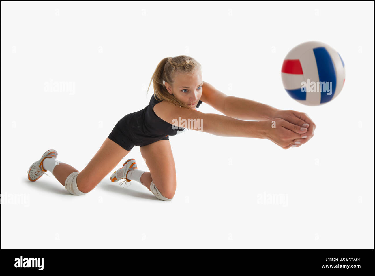 Young girl playing volleyball Stock Photo