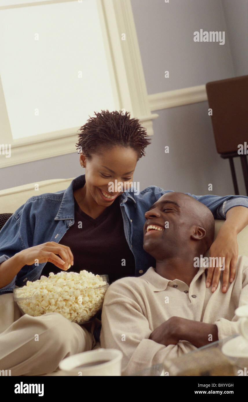 Couple eating popcorn Stock Photo Alamy