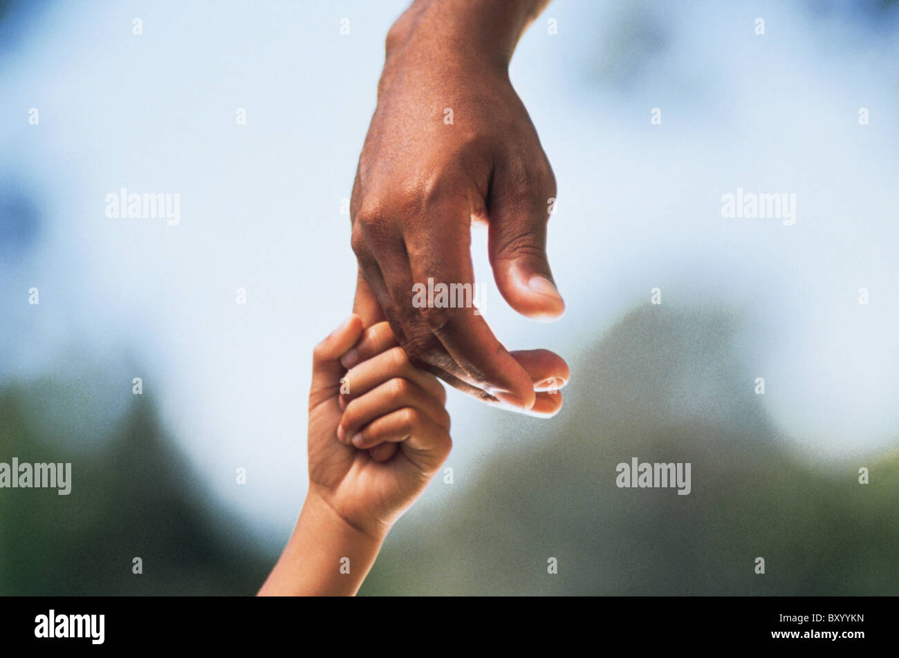 Child holding adult's hand Stock Photo - Alamy
