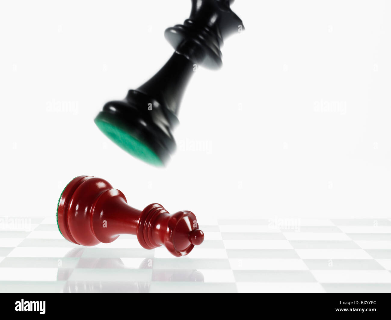 Rival queen chess pieces fighting Stock Photo