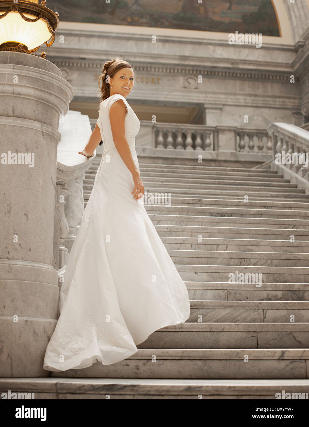 Portrait of bride on steps Stock Photo - Alamy