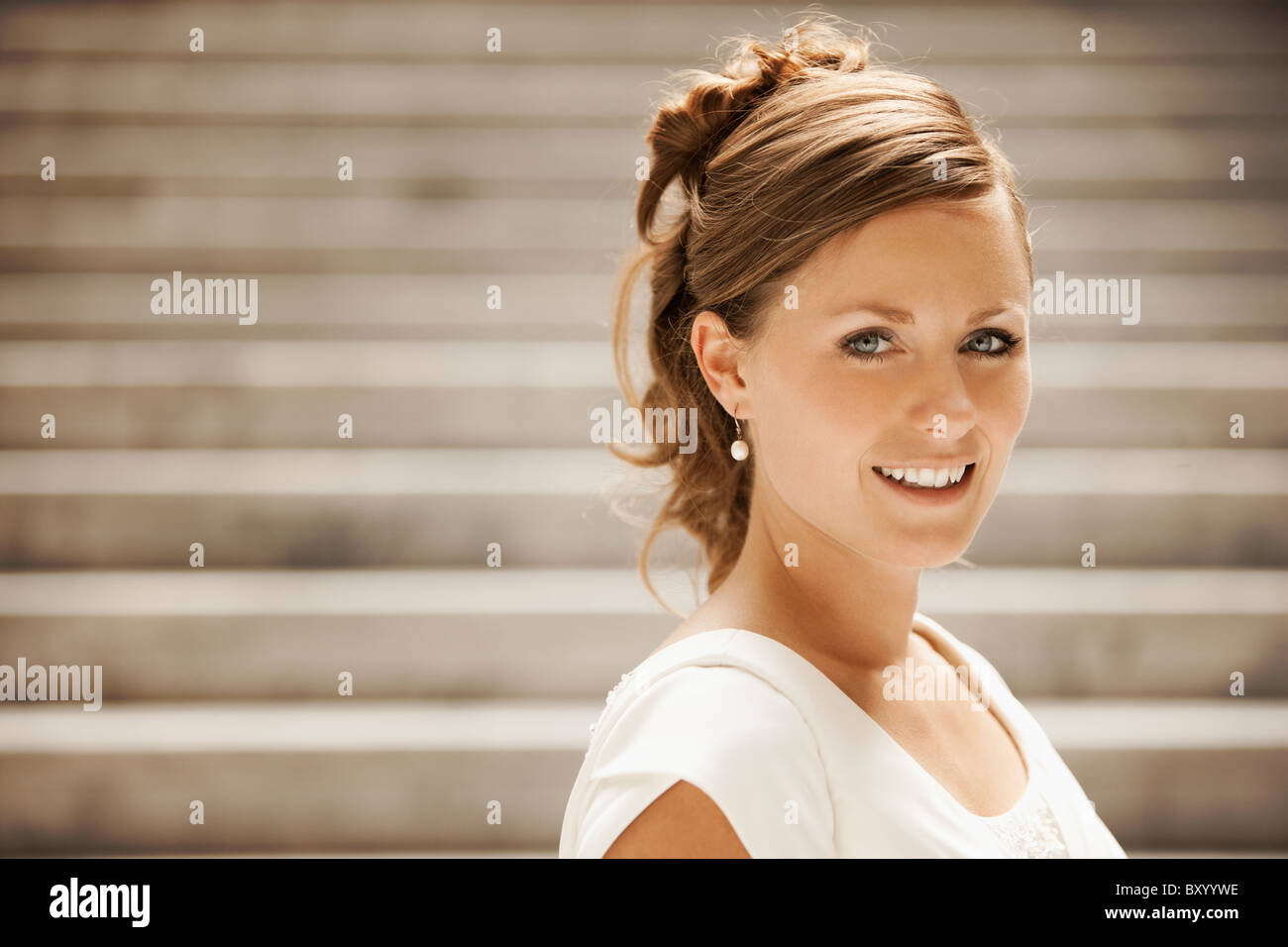 Portrait of bride on steps Stock Photo - Alamy
