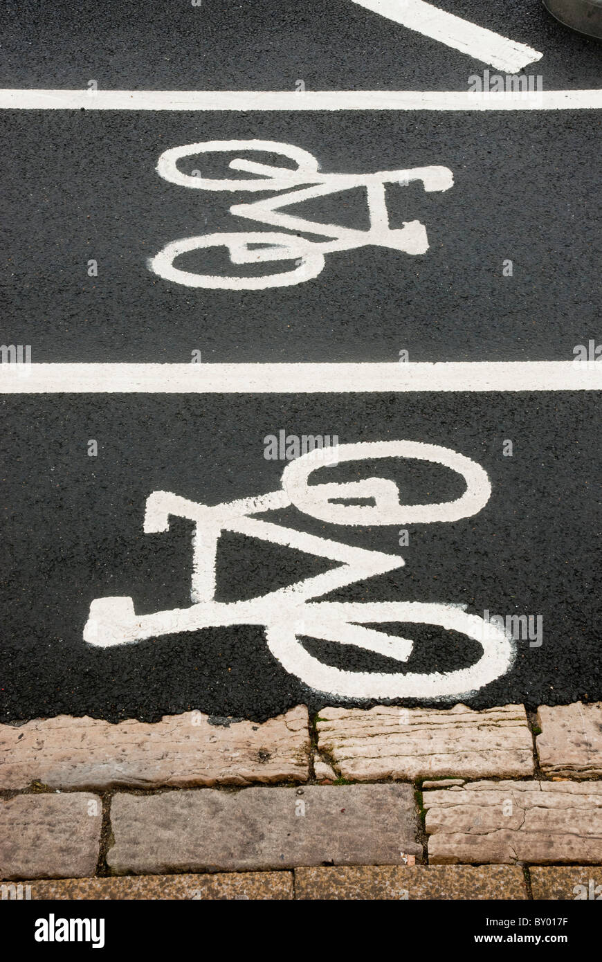Cycle lanes symbols painted on road Stock Photo