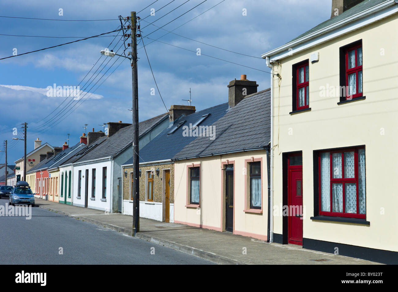 Street scene pastel painted terraced homes in Kilkee, County Clare, West of Ireland Stock Photo