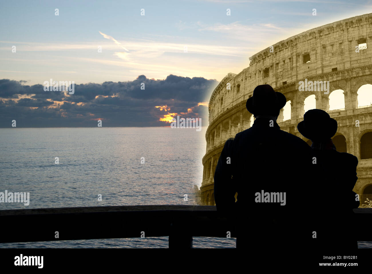 Surrealism. Couple at the Colosseum. The monument is depicted in sea. Stock Photo