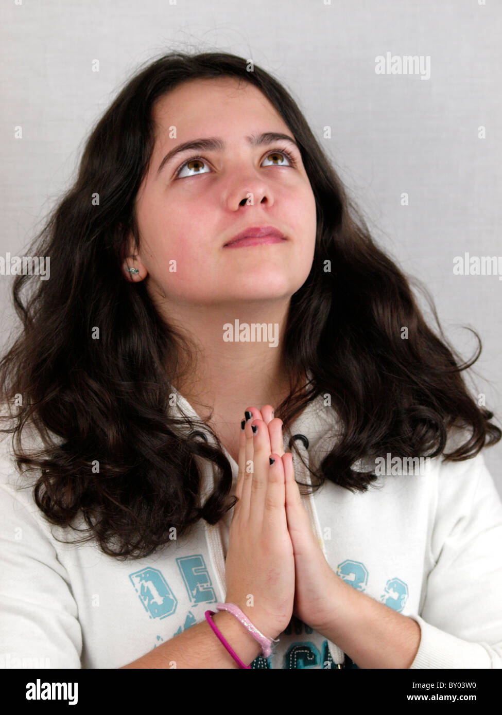 Young teen praying, UK Stock Photo Alamy