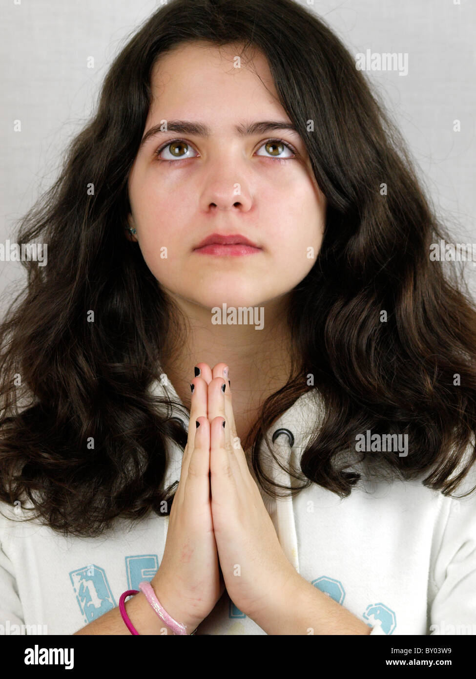 Young teen girl praying, UK Stock Photo Alamy
