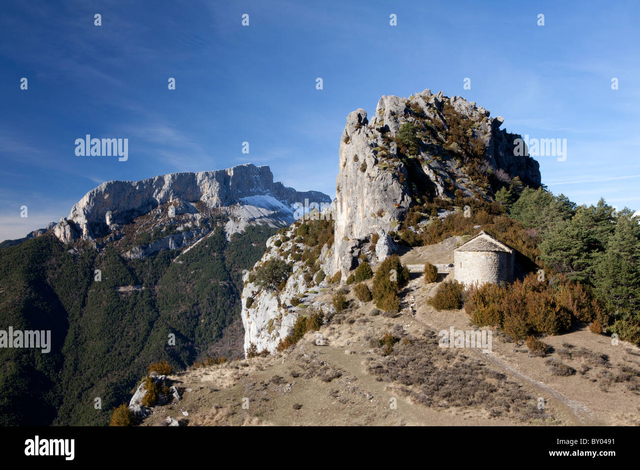 Hermitage of S. Juan and S. Pablo and Castillo Mayor peak, Tella, National Park of Ordesa and Monte Perdido, Huesca, Spain Stock Photo