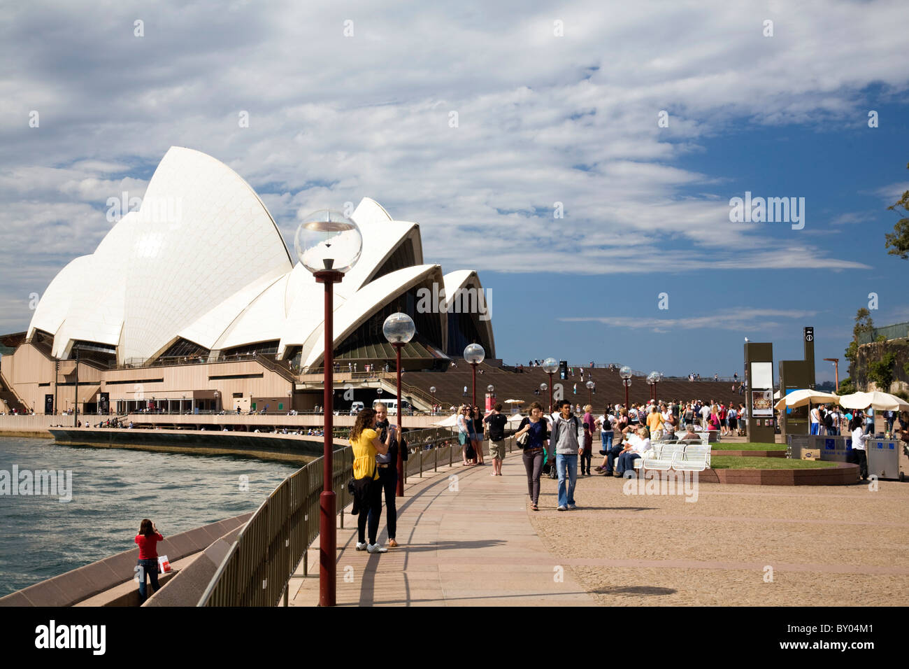 Sydney opera house and tourists visiting the famous landmark in Sydney city centre,NSW,Australia Stock Photo