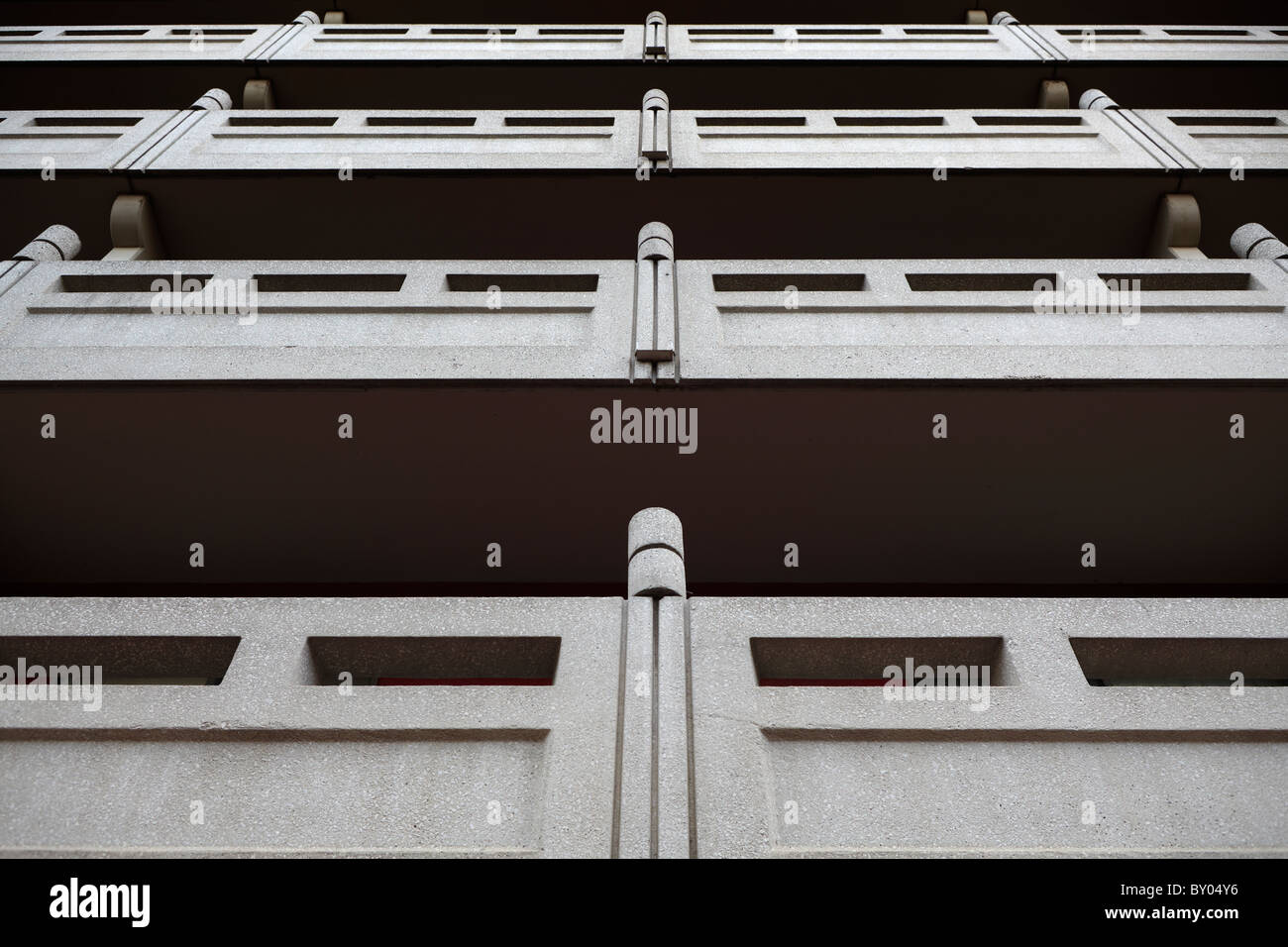 Four levels of balconies on the exterior of an apartment building. Stock Photo