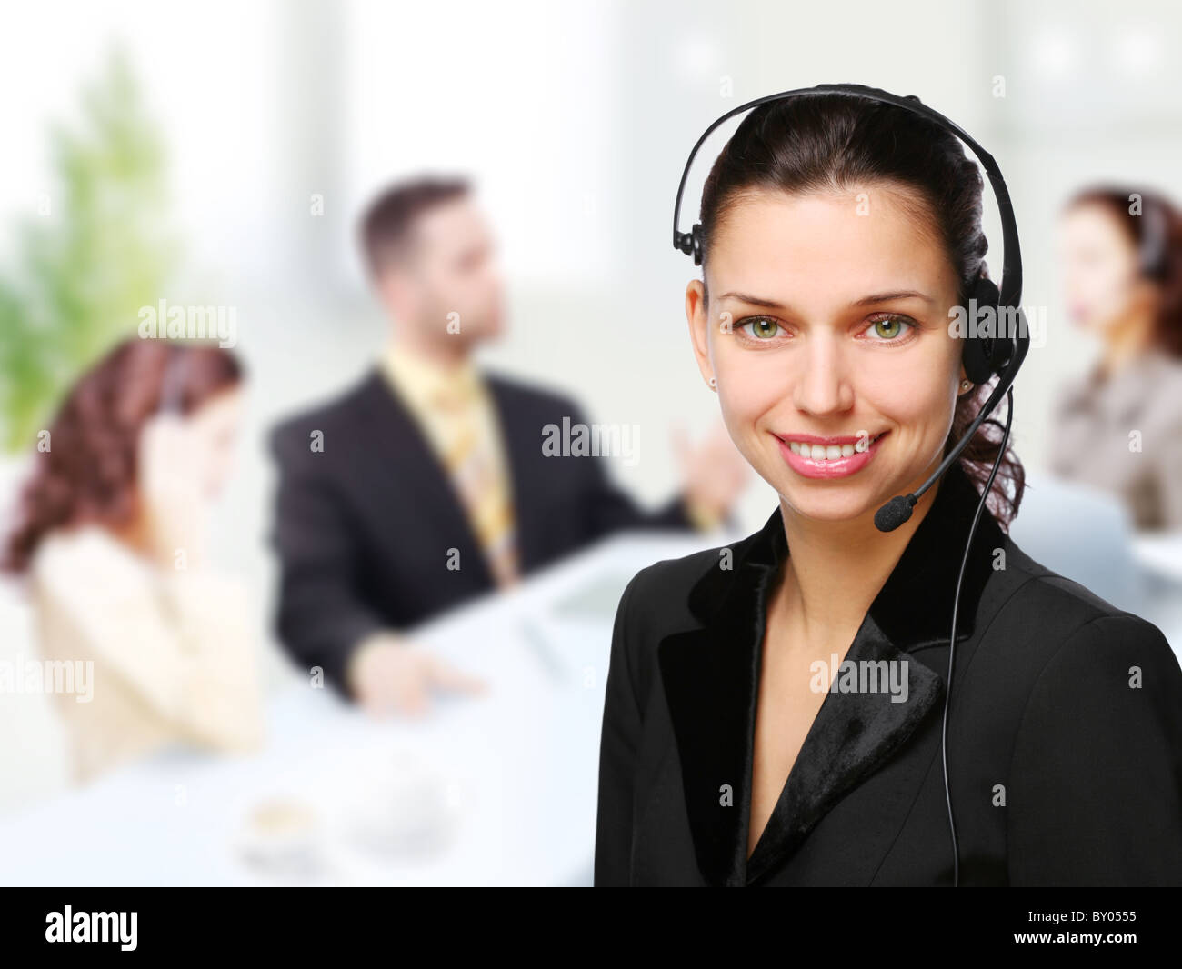 Customer support operator woman smiling at an office Stock Photo