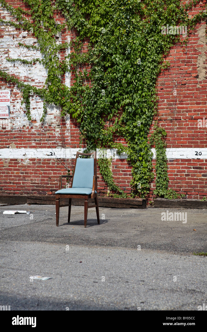 A chair sits in an empty parking lot. Stock Photo