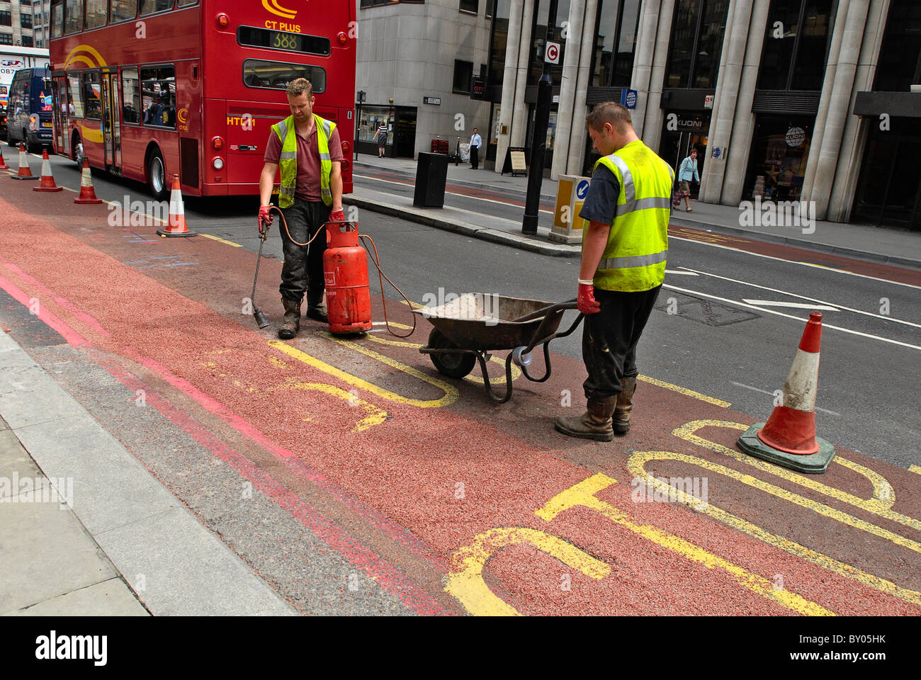 Construction road work at bus stop City of London England UK Stock Photo