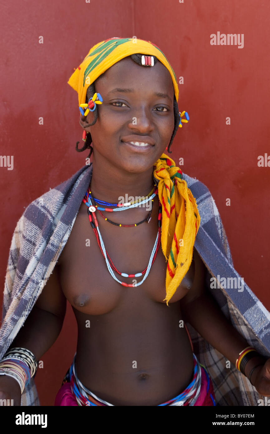African teenage girl of Zemba tribe, Opuwo, Kaokoland, NW Namibia Stock Photo