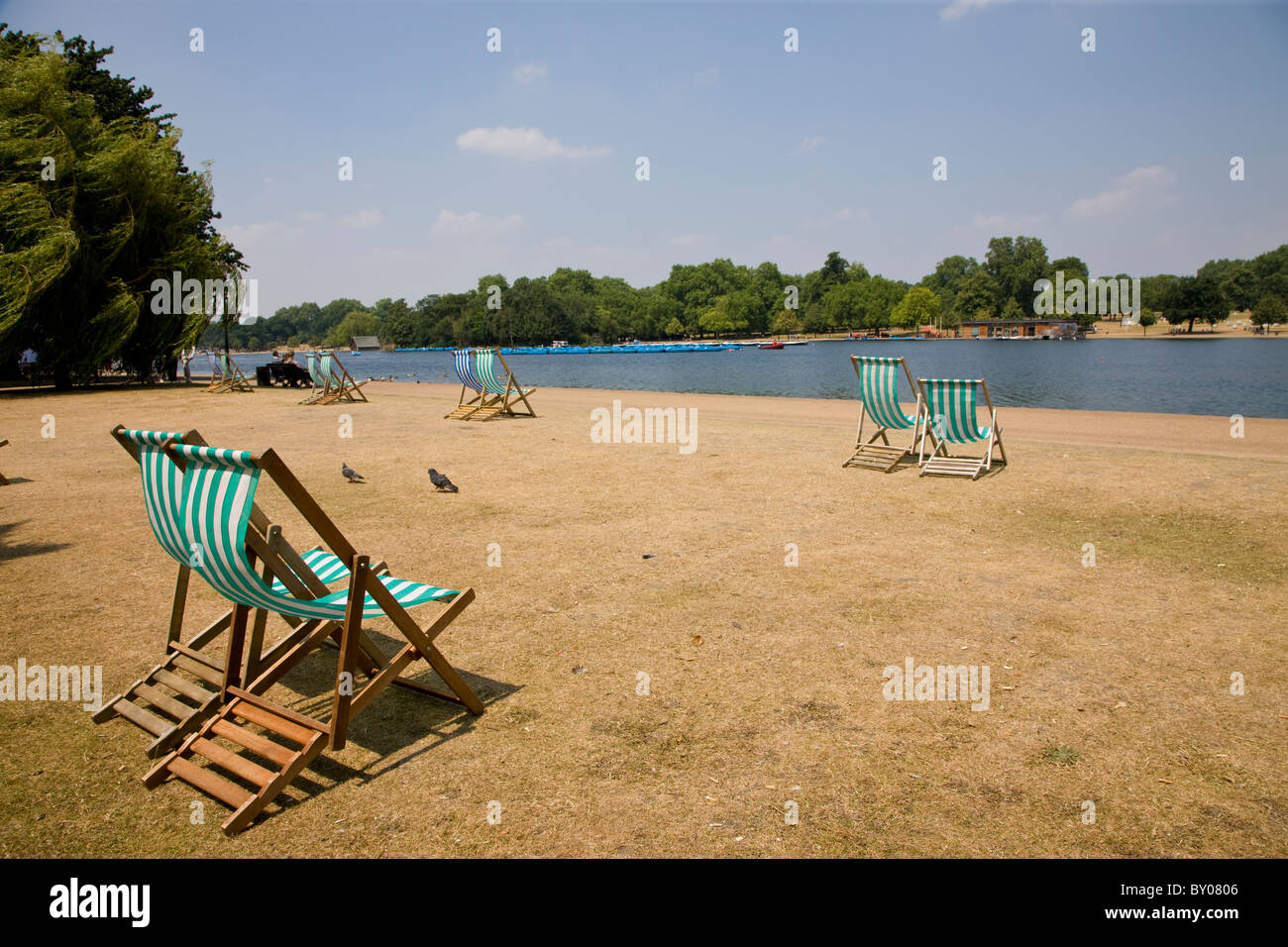Deckchairs overlooking the Serpentine in Hyde Park Stock Photo