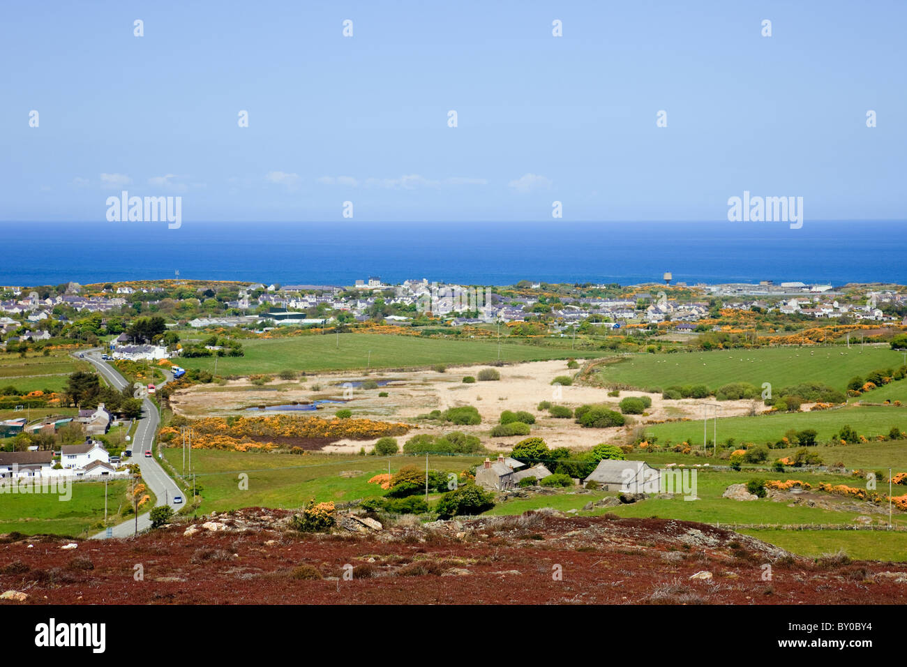 High view across countryside to Amlwch on the Welsh coast from Parys Mountain. Amlwch, Isle of Anglesey, North Wales, UK Stock Photo