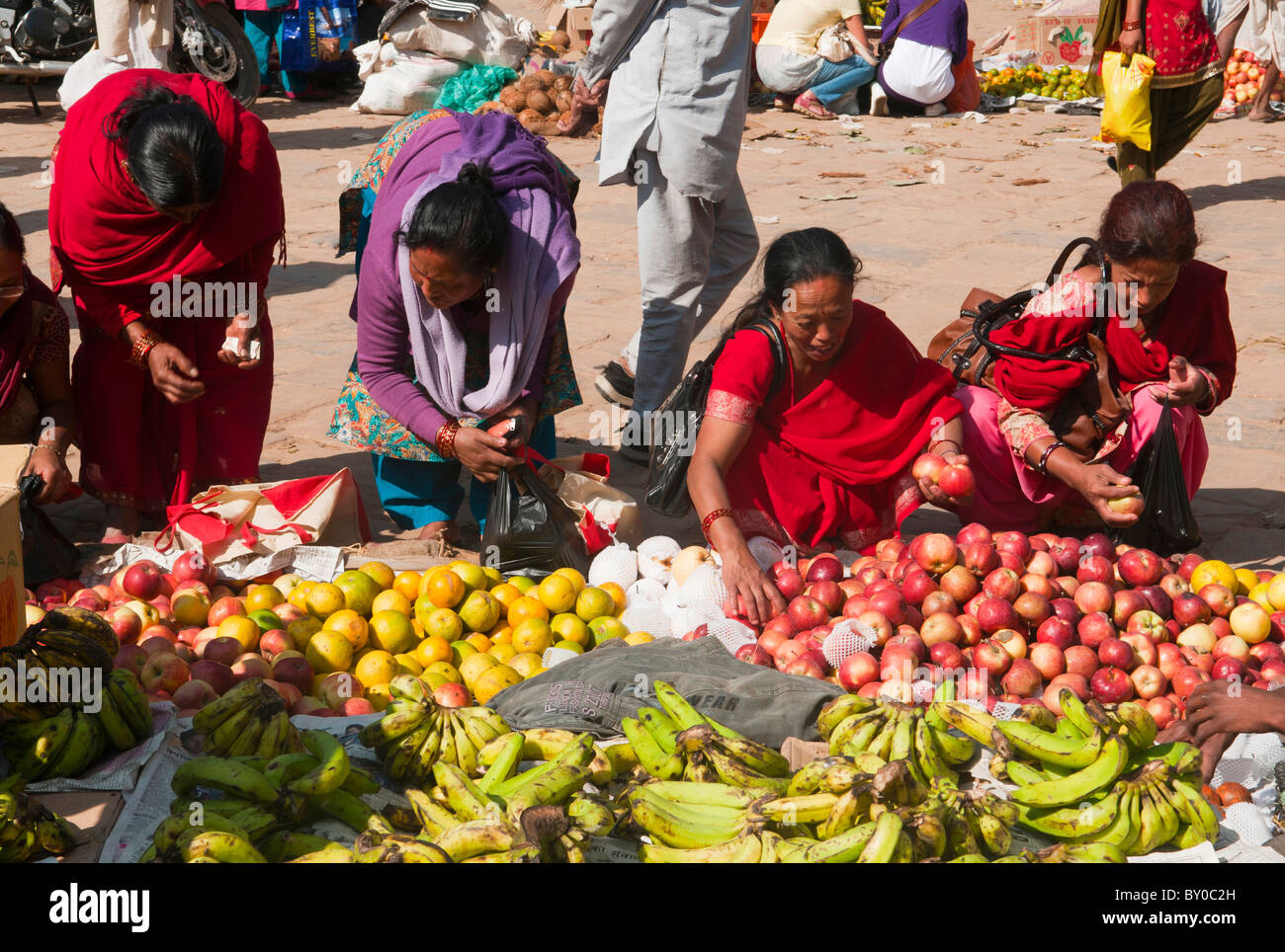 Nepali women buying fruit in the market in Kathmandu, Nepal Stock Photo