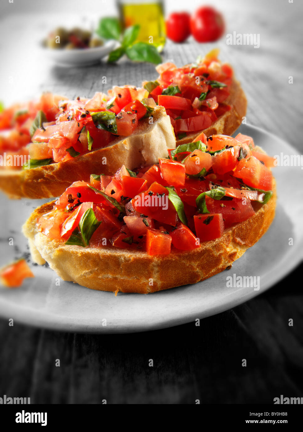 Fresh chopped beefsteak tomato bruschettas Stock Photo
