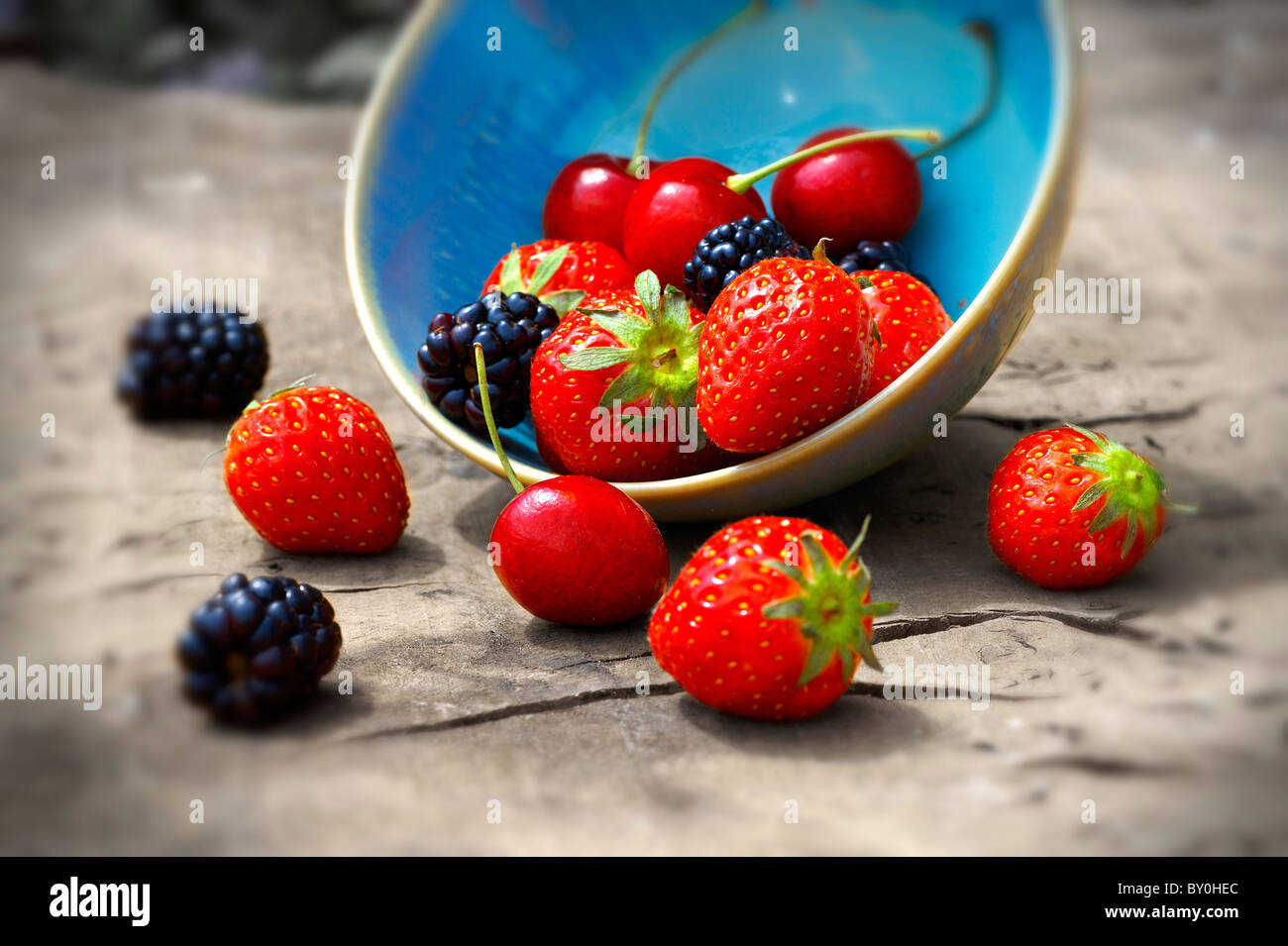 mixed fresh summer fruits - strawberry, blackberry, cherry Stock Photo