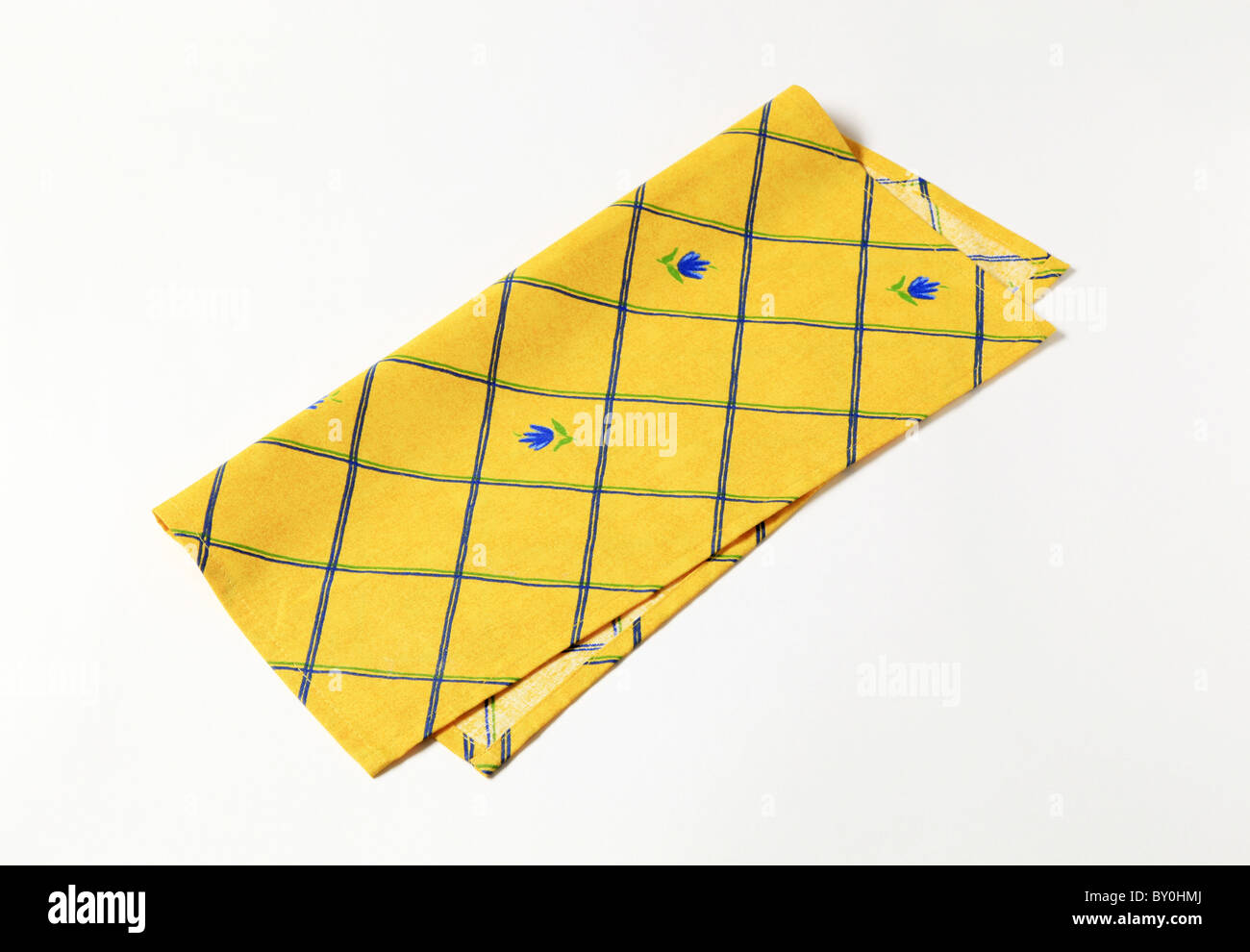 Small yellow napkin with flower pattern Stock Photo