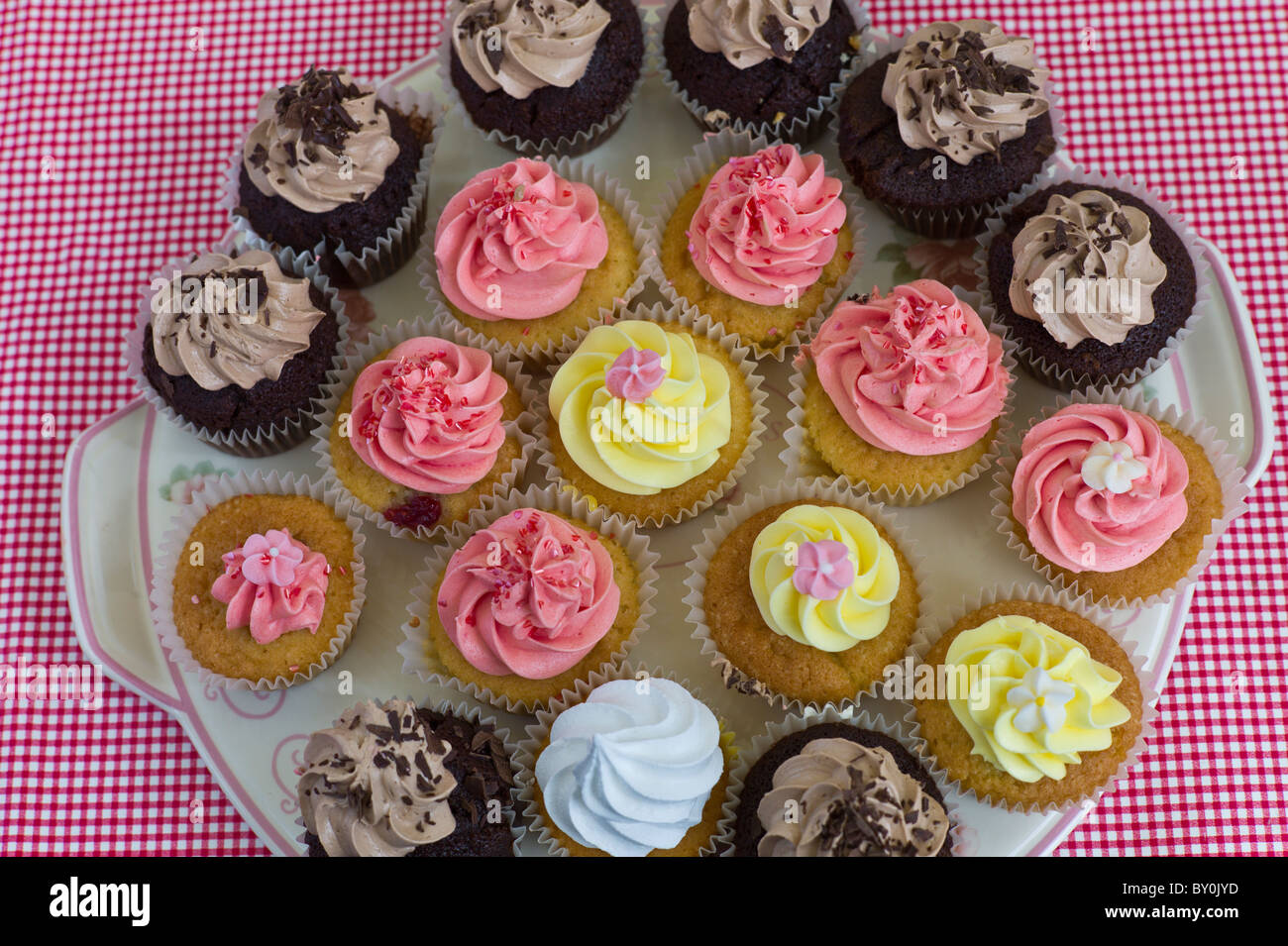Brightly coloured cup cakes on sale at Farmers Market, County Clare, West of Ireland Stock Photo