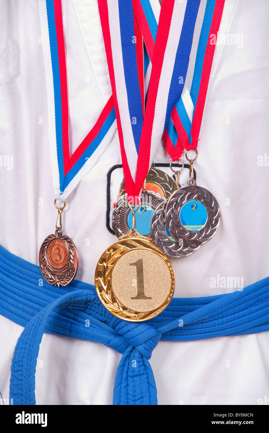 attractive teenage boy wearing winning medal around his neck Stock Photo