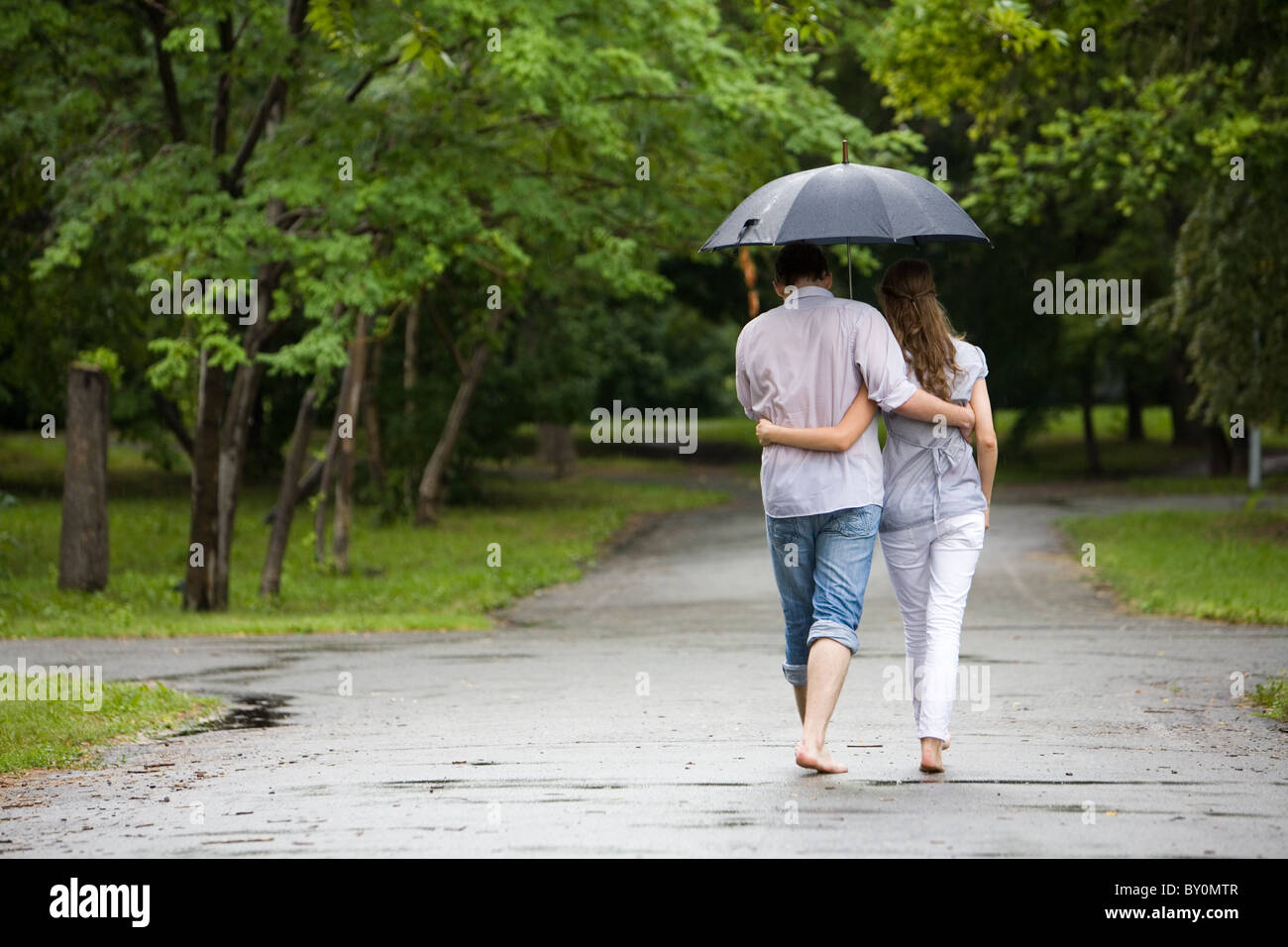 Loving couple in rain umbrella hi-res stock photography and images - Alamy