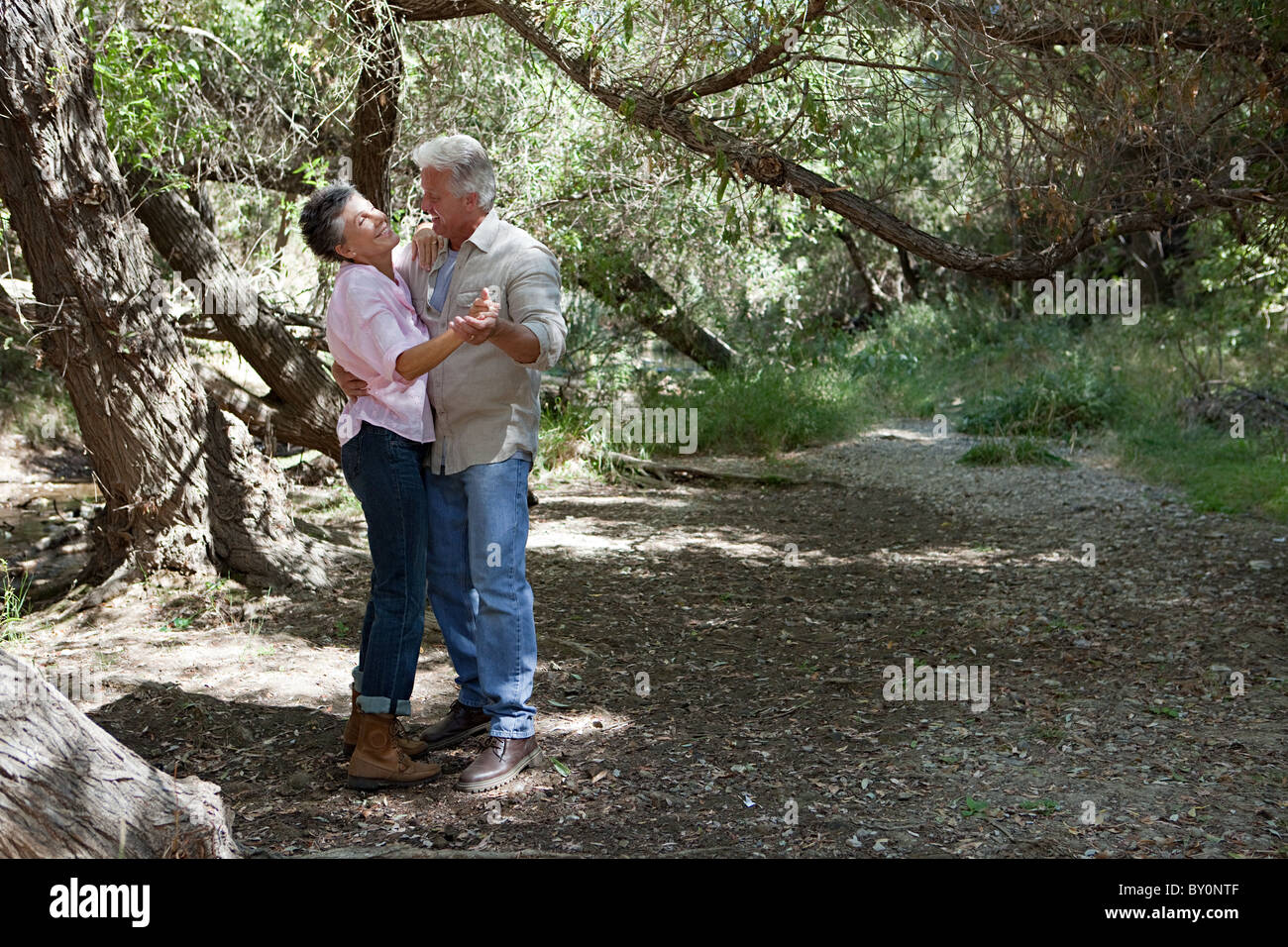 Mature Couple Dancing In Forest Stock Photo Alamy
