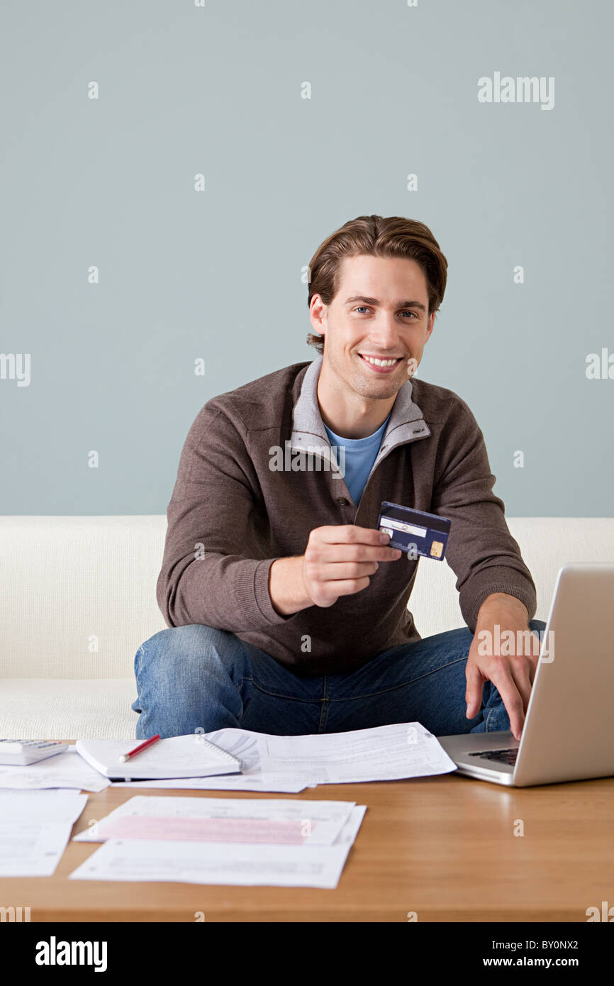 Man laptop using credit card hi-res stock photography and images - Alamy