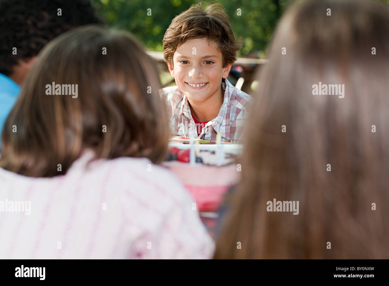 Boy at birthday party eating birthday cake Stock Photo - Alamy