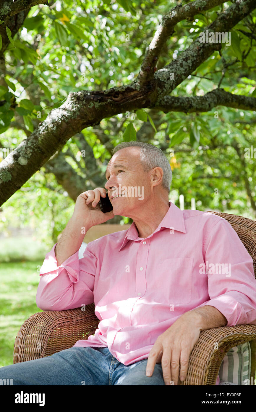 Senior man using mobile phone Stock Photo - Alamy
