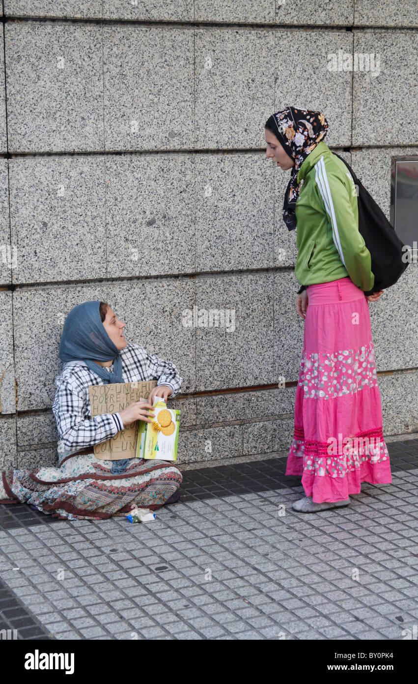 East European beggars on street in Spain Stock Photo