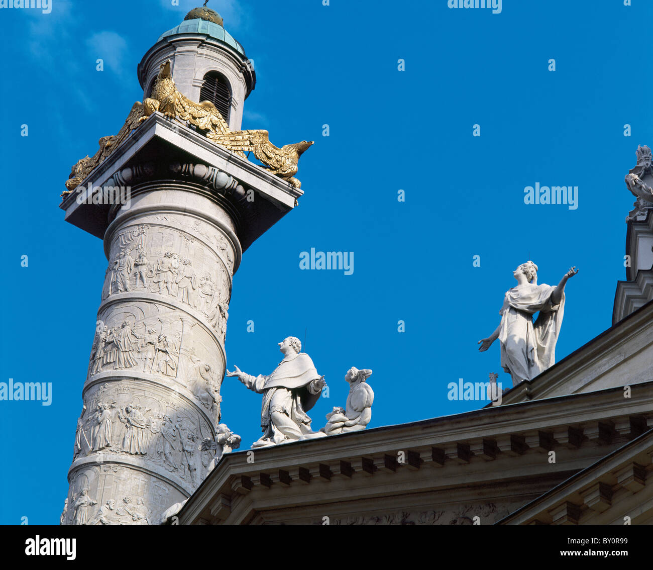 Karlskirche. Column on the left side of the church depicting scenes from the life of St. Charles Borromeo. Vienna. Austria. Stock Photo