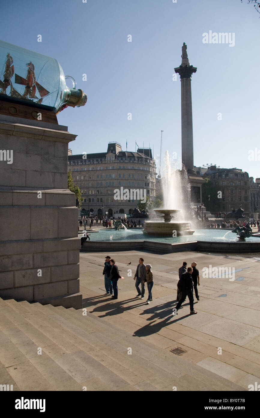 Trafalgar Square with Nelson's Ship by Anglo-Nigerian artist Yinka Shonibare installed on the vacant 4th plinth. Stock Photo