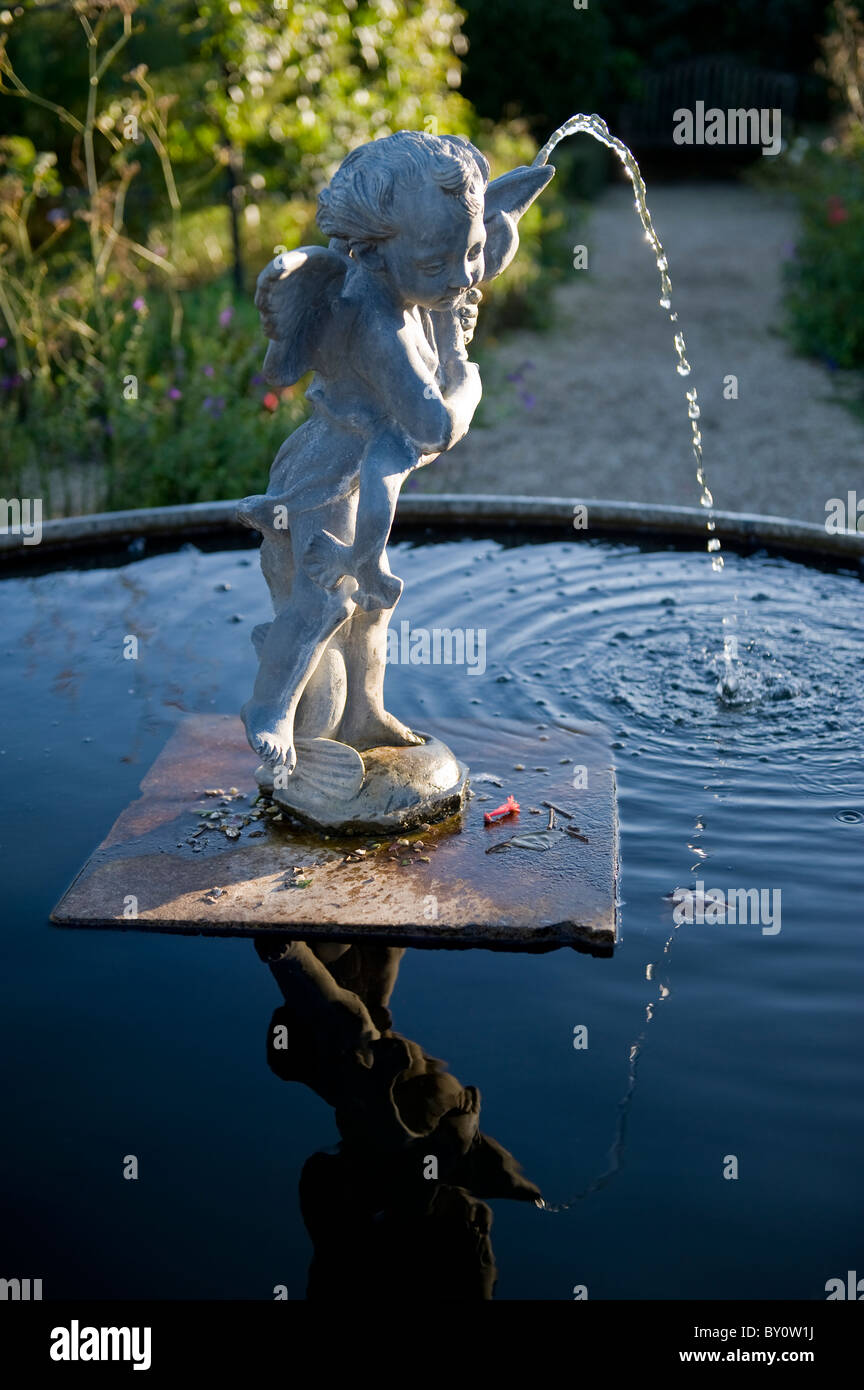 Fountain statue of Eros in the Collector Earl's Gardens at Arundel Castle, photographed late afternoon, West Sussex, UK Stock Photo
