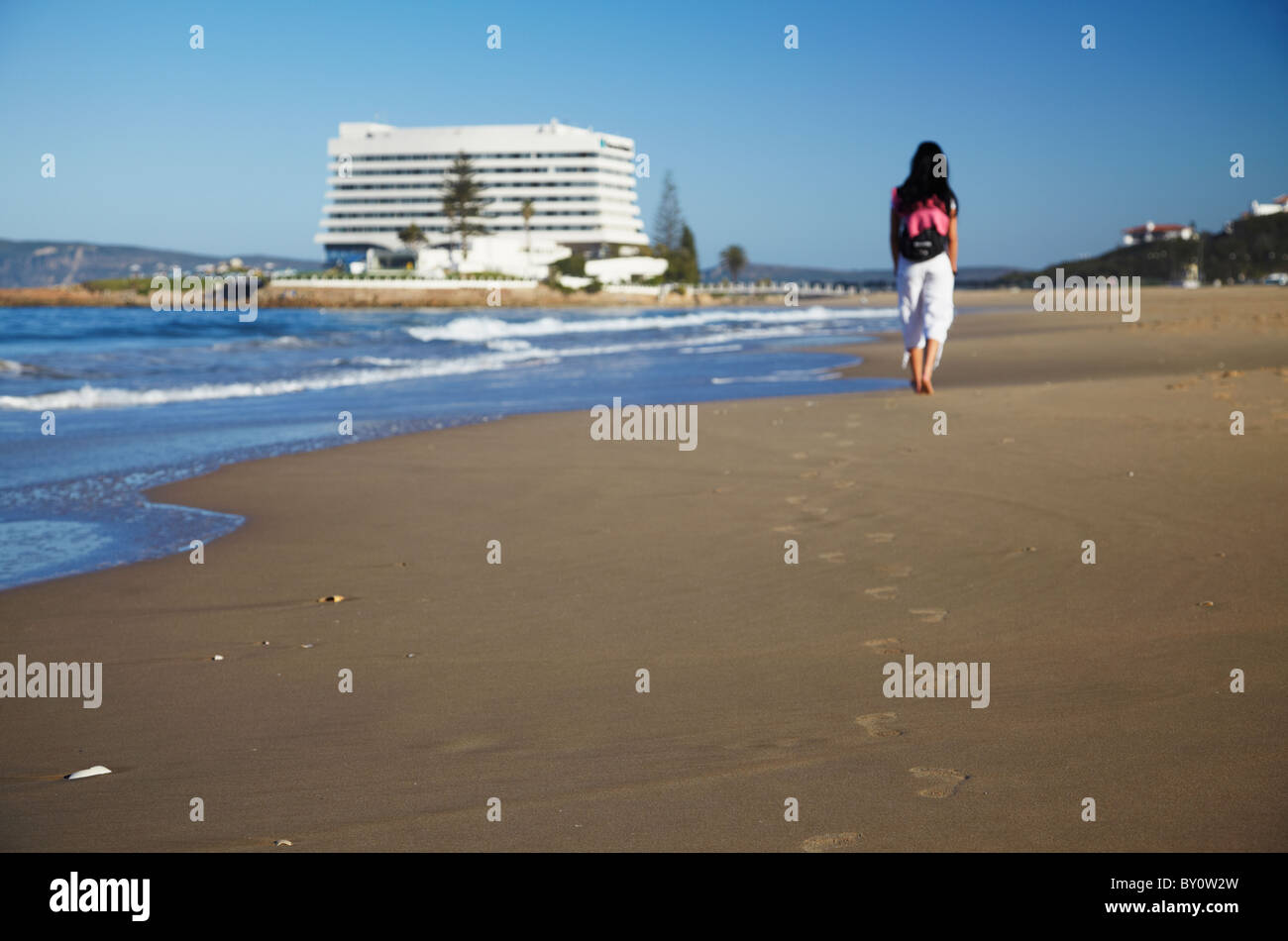 Woman walking on beach, Plettenberg Bay, Western Cape, South Africa Stock Photo Alamy