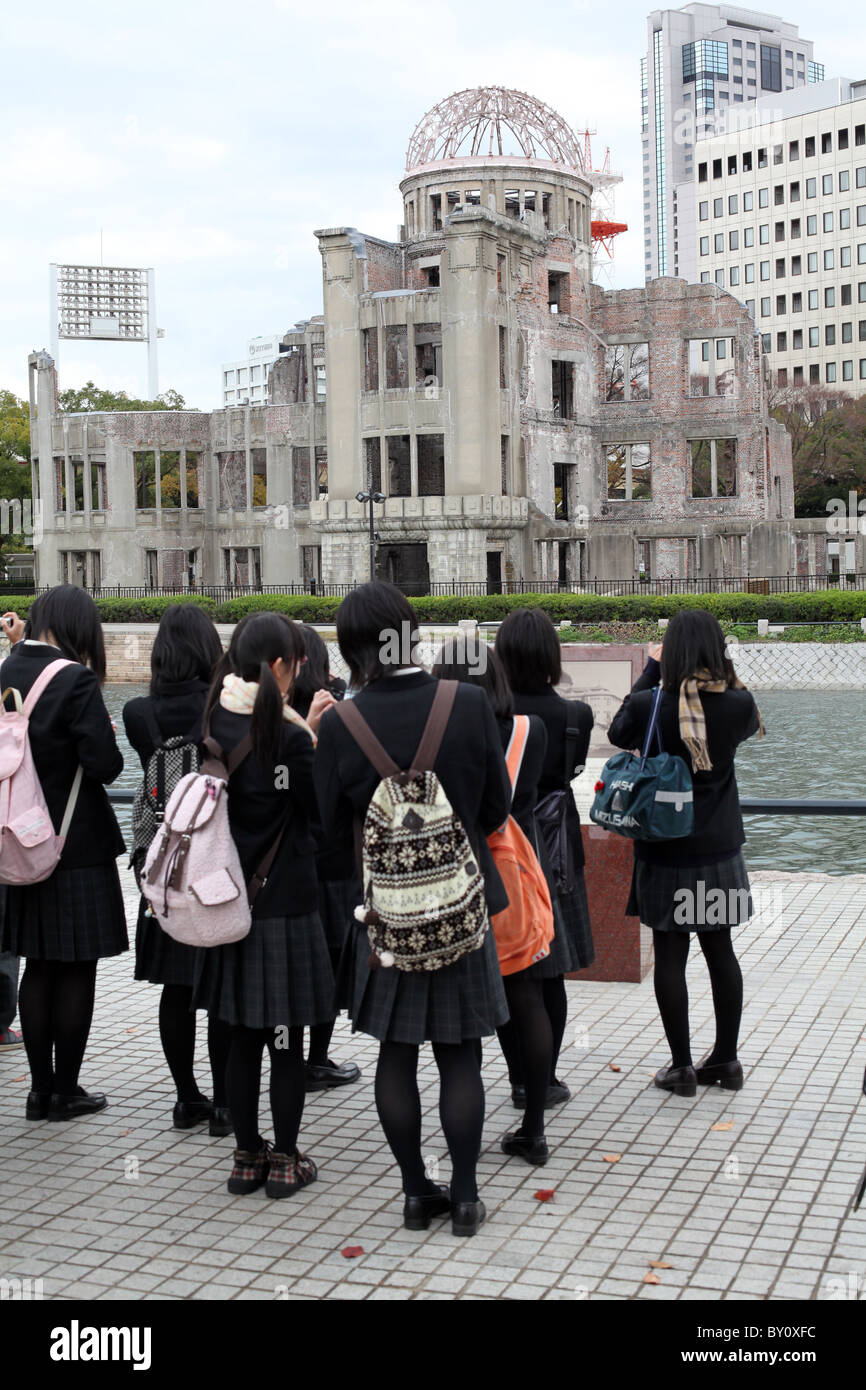 Schoolgirls visit the A Bomb Dome in Hiroshima, Western Honshu, Japan. Stock Photo