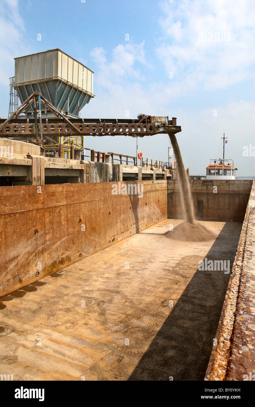 Barge loading feeder conveyor for aggregates export Kent UK Stock Photo