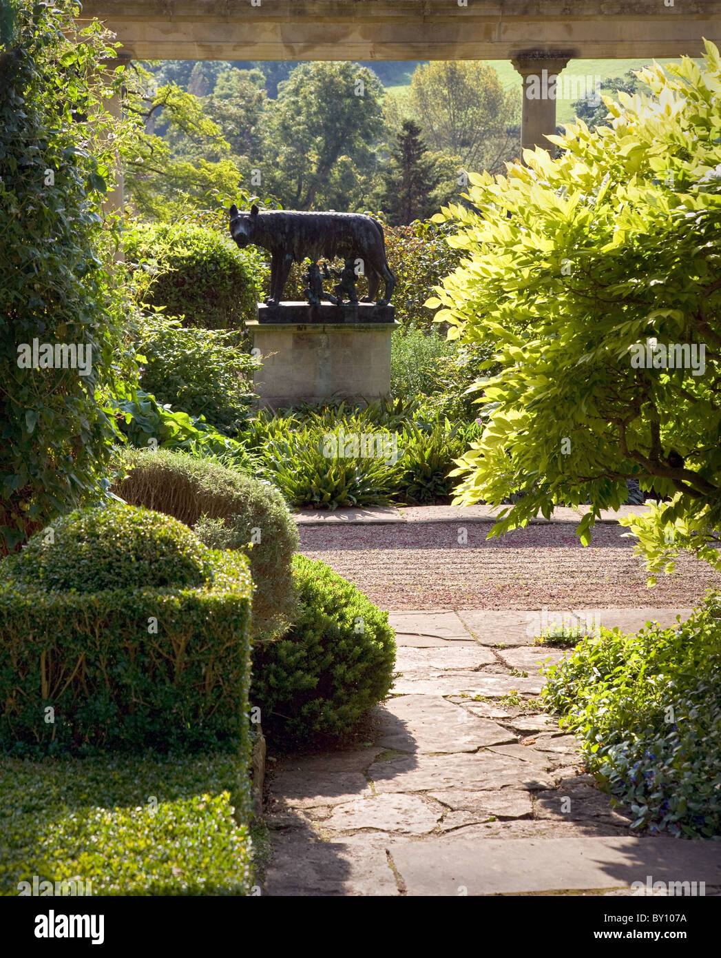 Bronze sculpture of Romulus and Remus and the shewolf in the Peto garden at Iford Manor in the Frome valley Wiltshire Stock Photo