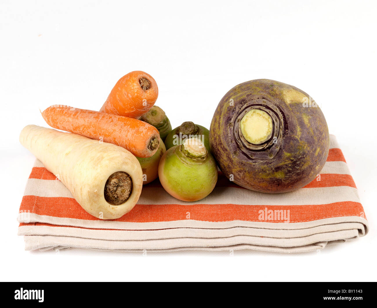 Fresh Raw Uncooked Root Vegetables Including Swede Turnips Carrots And Parsnips Isolated Against A White Background With No People And A Clipping Path Stock Photo