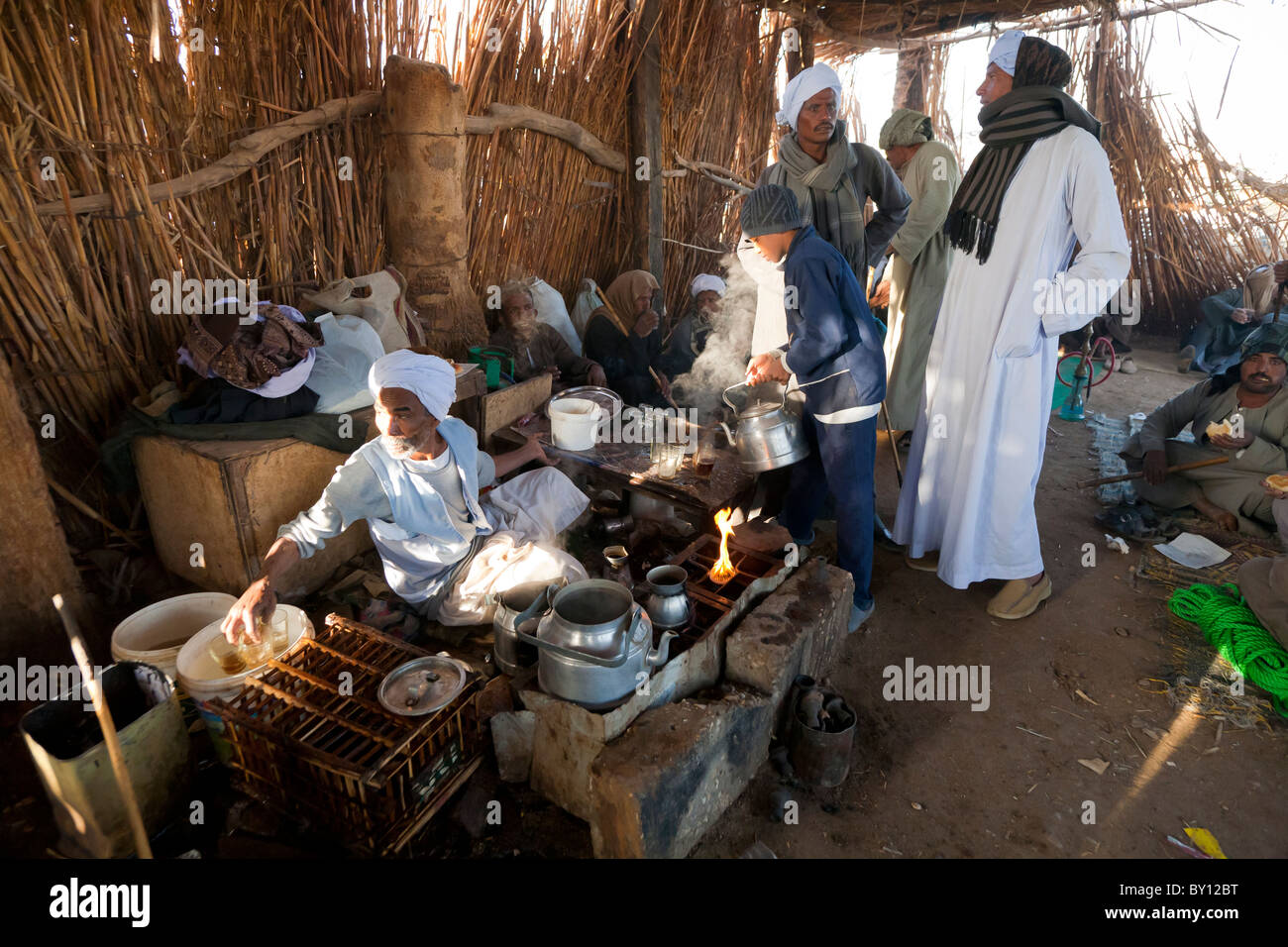 Men talking and tea drinking in rest area at Luxor Camel Market Egypt Africa Stock Photo