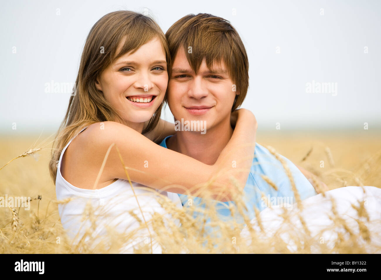 Image of handsome man and beautiful girl looking at camera Stock Photo ...