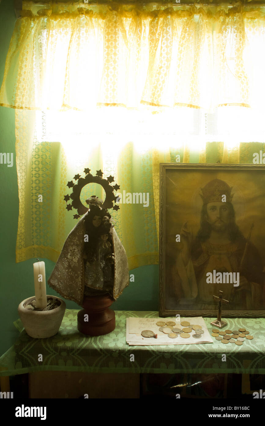 A number of relics are arranged on a table as a shrine. Stock Photo